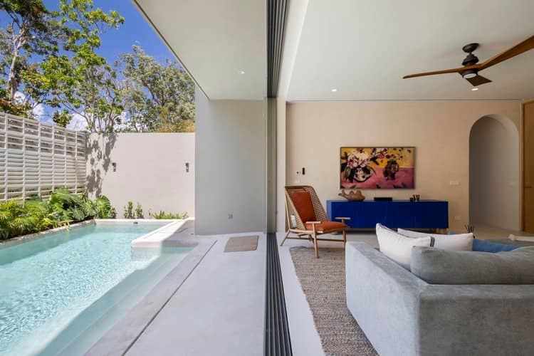 Indoor-outdoor pool representing the cenote experience near Tulum