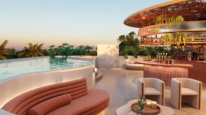 Rooftop lounge seating at The Curve Tulum at sunset